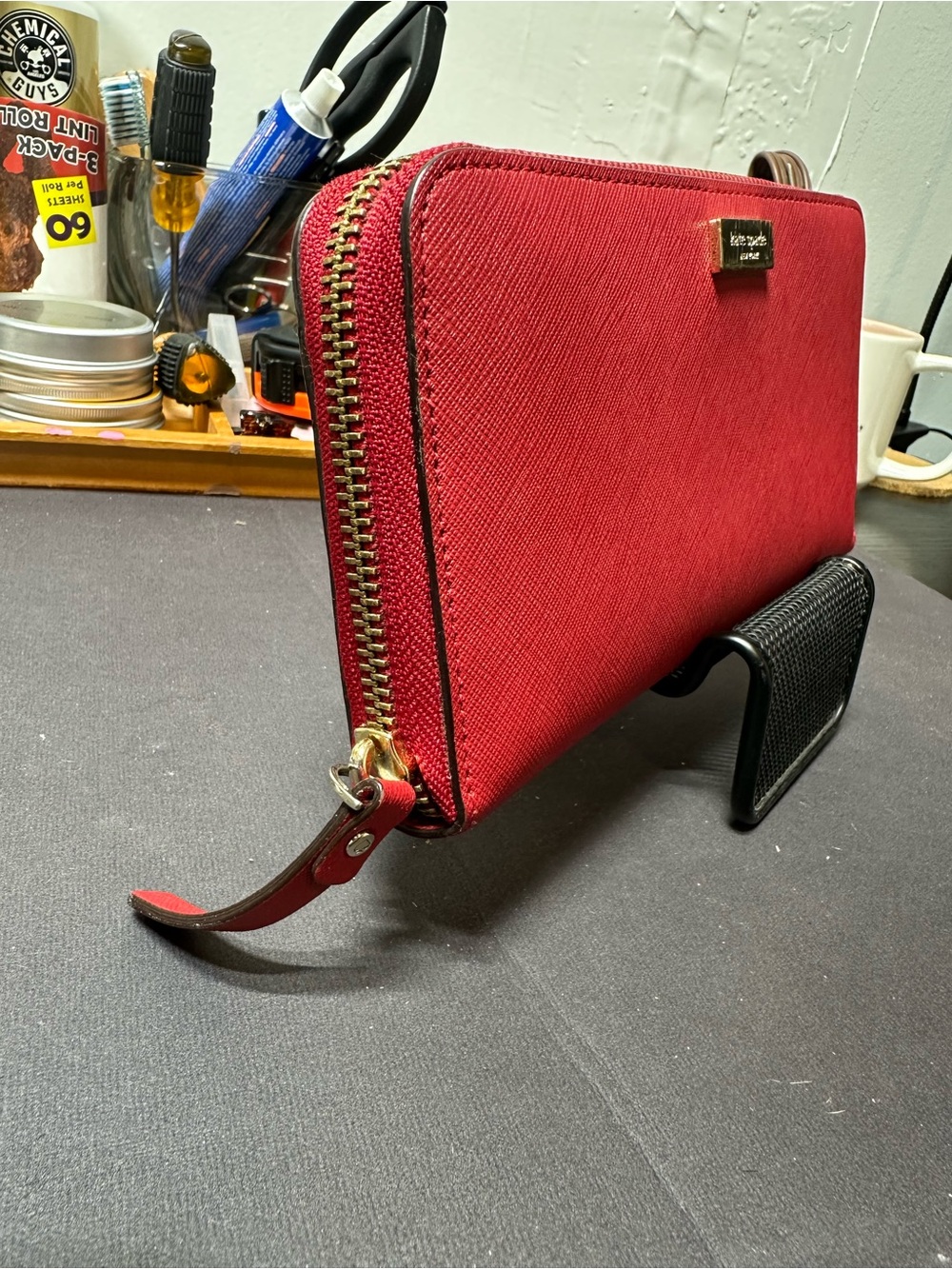 kate spade red zip-around Saffiano wallet with gold plaque